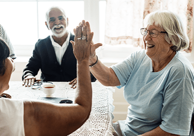 Elderly people high fiving