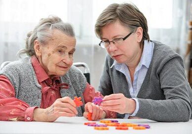 Senior woman with her elder care nurse